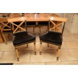A set of six Clive Christian Empire style parcel-ebonised and parcel-gilt beech dining chairs, the