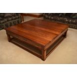 A recent Charles Barr stained beech coffee table, with two frieze drawers with Gothic style handles,