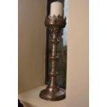 A pair of recent ecclesiastical style pewter candlesticks, with cast foliate decorated on knopped