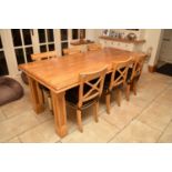 A Clive Christian light oak dining table, the moulded top above a plain deep inset frieze, raised on