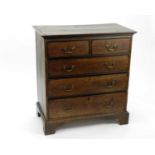 An early 19th century rectangular oak chest of drawers