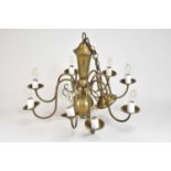 A Continental brass eight-light chandelier, 20th century, the baluster stem issuing slender S-scroll