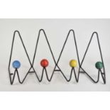 A Roger Feraud mural coat rack, mid 20th century, painted metal with blue, red, yellow, and green