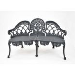 A Victorian revival cast iron garden bench, painted grey, 135cm wide, seat height 40cm.Footnote: