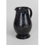 A Jackfield black-glazed baluster jug circa 1760 enamelled with ‘God Speed the Plough’ within a