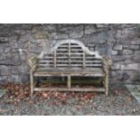 A Chatsworth type teak slatted garden bench.168cm wide, 59cm deep, 102cm highFootnote: Provenance: