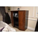 A bespoke contemporary walnut veneered and composite entertainment cabinet, by Andrew John Lloyd, of