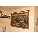 A machine-woven tapestry wall hanging, worked in the medieval style with a scene of unicorn and lion