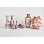 A group of Japanese Arita and Kutani porcelain, including two pairs of small Imari bottle vases,