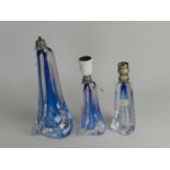 Three Val St. Lambert glass lamp basescirca 1960of wrythen form, blue colourway, two retaining
