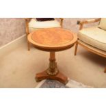 A recent Clive Christian walnut parcel gilt circular occasional table, the cross-banded top above