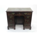 A George III mahogany kneehole dressing chest