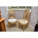 A pair of recent Clive Christian giltwood upholstered balloon back side chairs, with pierced