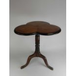 A 19th century walnut, trefoil-shaped top occasional table