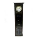 A Magneta, London, electric wall clock, the plain oak case with cavetto cornice, the white dial with