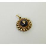 A Victorian style garnet and diamond locket pendant