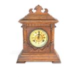 An oak cased Ansonia American mantel clock