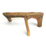 An East African Kenyan Rendille tribal headrest or low stool, of semi-natural form, the surface