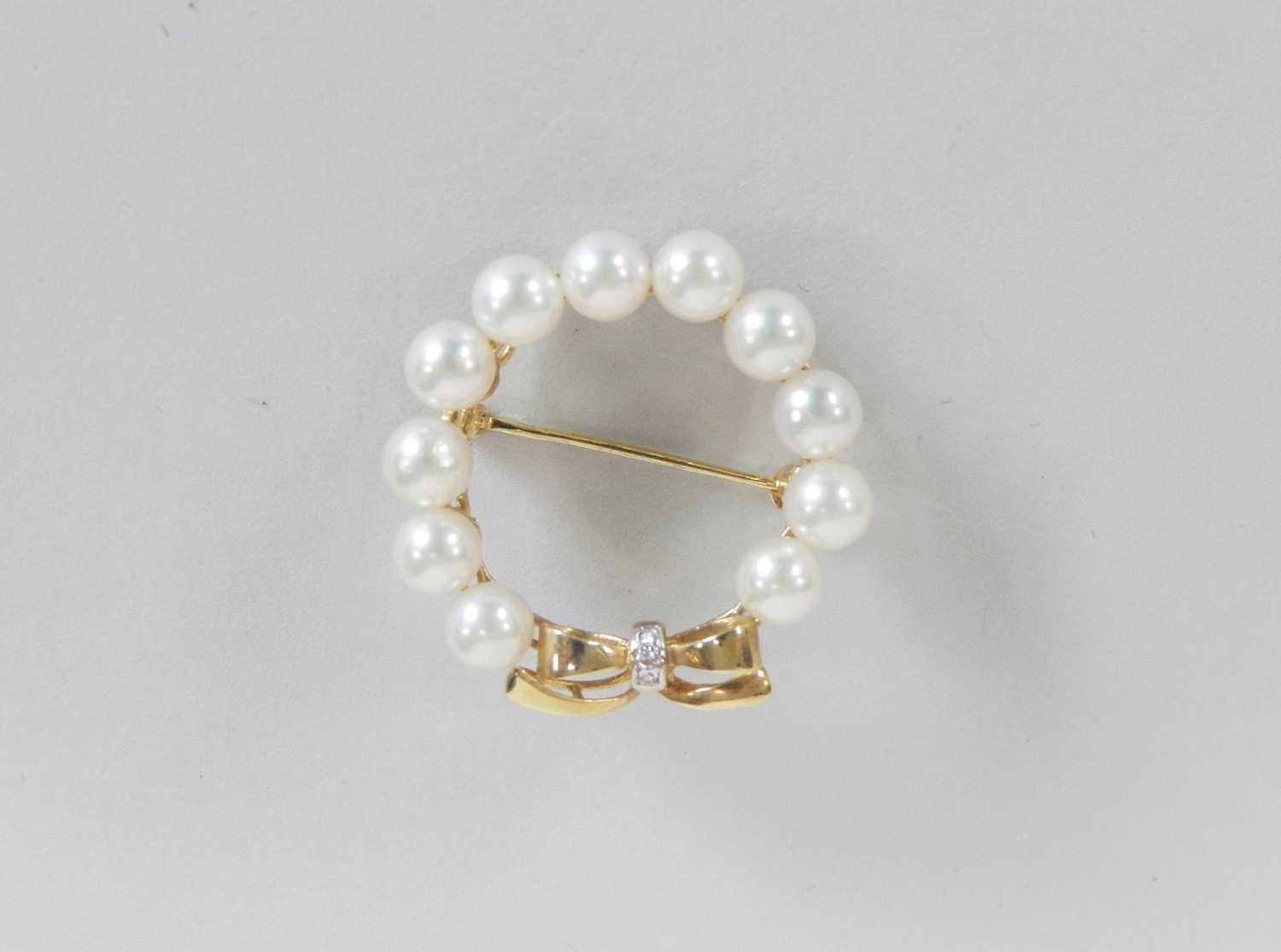 A cultured pearl and diamond set wreath brooch