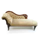 A Victorian mahogany chaise longue