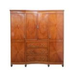 An Edwardian figured satinwood wardrobe and dressing table