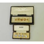A cased collection of graduated yellow metal studs