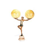 An Art Deco spelter figural lamp of a lady holding aloft a spherical light in each hand