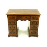 A 19th century, George II style, walnut veneered twin pedestal desk