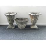 A pair of Coade-style garden urns, of lotus form and another (3)