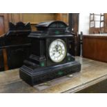 A French black marble mantel clock, circa 1900, the architectural case with malachite inserts and