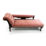 A late Victorian carved mahogany chaise longue, with another (2)