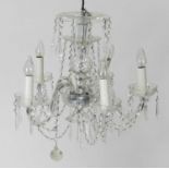 A pair of cut glass five-light chandeliers