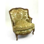 A 20th century upholstered armchair