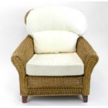 A contemporary wicker-work , conservatory armchair,