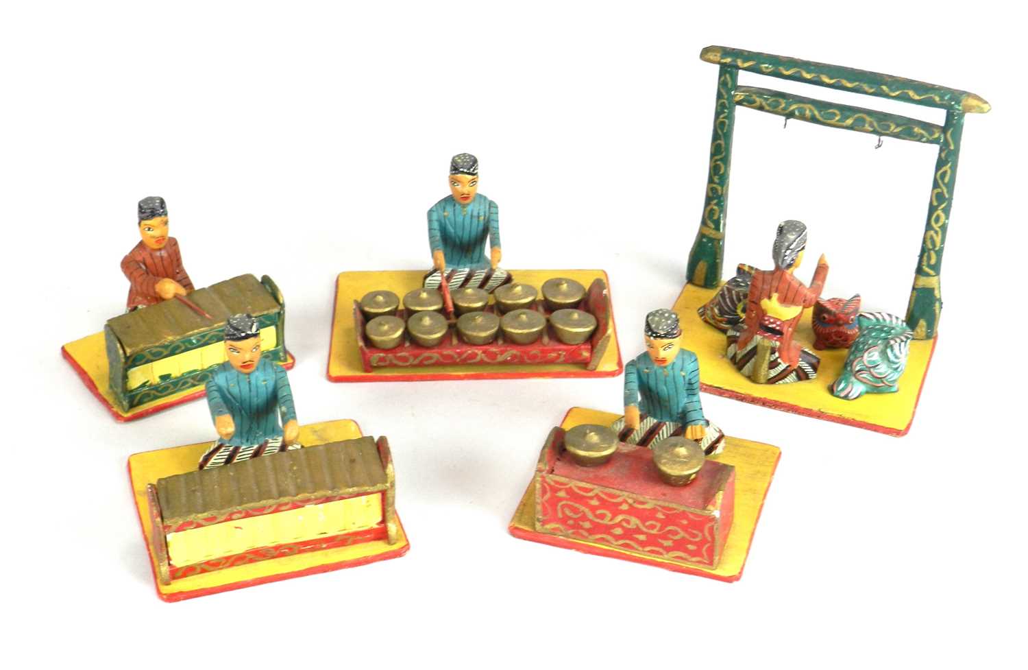 A set of recent vintage painted wood Indonesian Gamelan figures