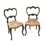 A set of 6 Victorian rosewood balloon back type dining chairs