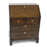 A small, well proportioned, George III oak bureau