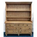 An 19th century and later pine kitchen dresser