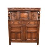 A 17th century style oak court cupboard