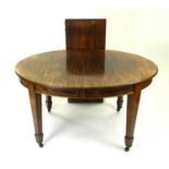 An Edwardian inlaid mahogany, oval extending dining table