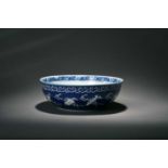 A blue ground reserve-decorated 'abundance' bowl, Qianlong four-character mark but 19th centuryOf