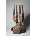 A large African carved wood two-headed effigy, Cameroon