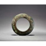 A Chinese silver-inlaid bronze harness ring, Zhou Dynasty/Warring States