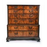 A good mid-18th century figured mahogany veneered chest on chest, with blind fretwork canted