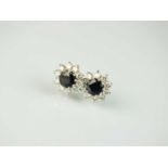 A pair of 18ct gold sapphire and diamond earrings