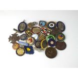 A collection of base metal and enamelled nursing medals