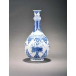 A Chinese blue and white garlic-head bottle vase, KangxiOf pear shape with garlic-head neck and