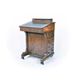 A 19th century inlaid walnut davenport