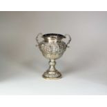 A 19th century Indian white metal twin handled urn