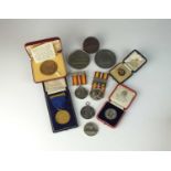 A large collection of silver, cupro-nickel, white metal and bronze nursing medals,